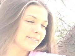 Sweet teen posing and showing her titties in the open