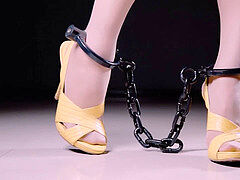 asian chained Treadmill ambling in Heels