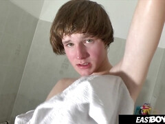 Teen boy Antony Carter gets a handjob in the bathroom