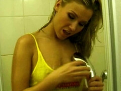 Blonde beauty mesmerizes with solo charm in a wet tease