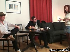 Poker playing granny swallowing two big cocks