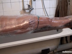 Vicky wrapped in plastic and gagged
