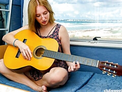 Sensual brown-haired chick Emma Korti is touching herself