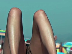 Bitch at the beach getting  horny nudist pussy wet