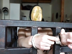 Elise Graves handcuffs herself and masturbates in a cage