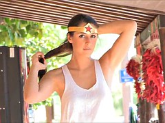 sexy brunette dresses as wonder woman in public