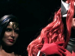 Masked redhead turns conflict with Wonder Woman into lesbian sex