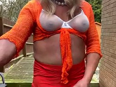 Amateur crossdresser Kellycd2022, sexy milf masturbates and pisses in panties, stockings and heels outdoors