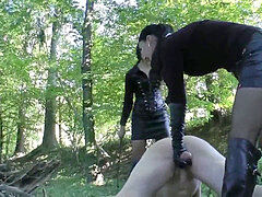 two mistresses punishing sub in the forest