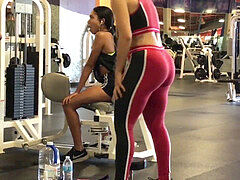 mixed girl with big bum in latex at the gym