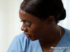 Ebony masseuse scissoring with busty client